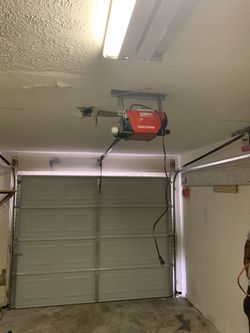 Garage door opener motor $ 330 plus intalation