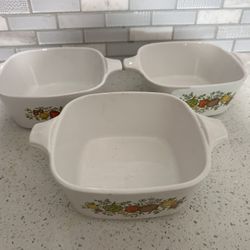 Line of three vintage corning ware spice of life petite casserole dishes