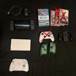 Nintendo Switch Bundle + 4 Games + Extra Controllers 