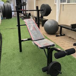 Gym Equipment Adjustable Bench press, barbell, leg developer and 100lbs of weight
