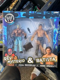 Rey Mysterio and Batista.