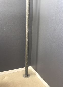 Pole to hang street signs in room