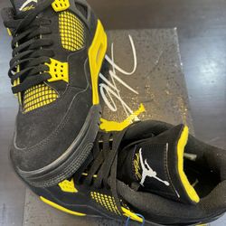 Air Jordan 4 Retro “Thunder” (Black/White–Tour Yellow)