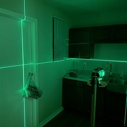 Laser level kit with telescoping tripod kit