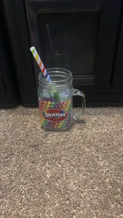 Skittles glass cup with straw and with green apple and grape flavor powder