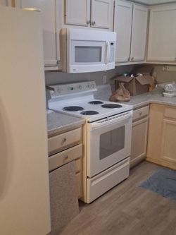 Refrigerator, Microwave, and Electric Stove