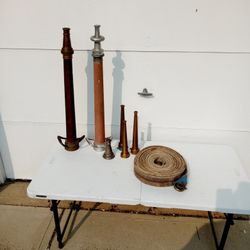 Various Antique Fire Nozzles & Hose