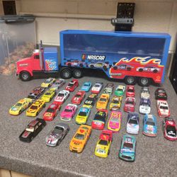  NASCARS AND TRUCK CAR HAULER 