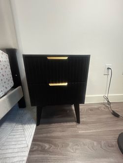 Two black fluted night stands