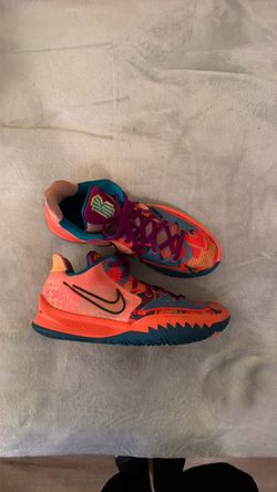 Kyrie 4 low used size 13 Authentic “ 1 world 1 people”