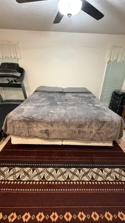 King Size Comfortaire Bed with Frame, Box Springs, and bedding.