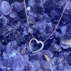 Woman’s Diamond Heart Shaped Pendant On 10K Yellow Gold