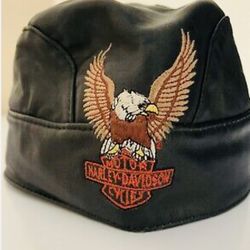 Harley Davidson Genuine Leather Skull Cap and a Vintage 1999 Black Harley Davidson Motorcycle Helm et With Visor 