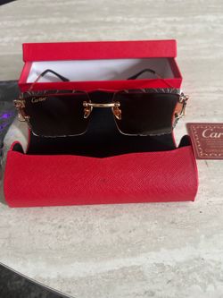 Black and gold Cartier glasses