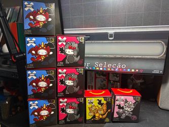 McDonald's Hello Kitty x Godzilla Toys with boxes