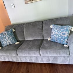 GREY COUCH / SOFA WITH PILLOWS