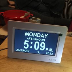 white frame large calandar clock