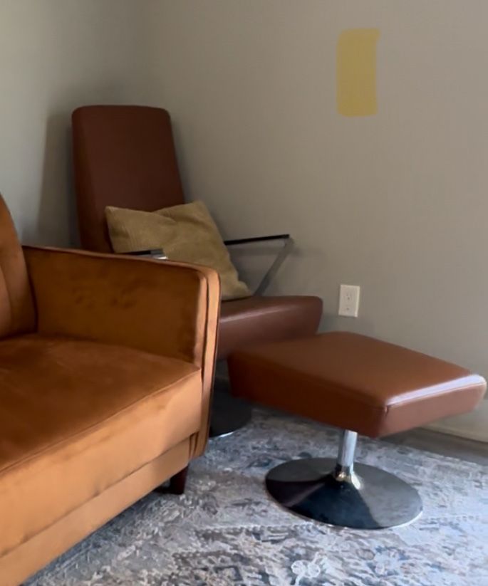 Leather Swivel Armchair and Ottoman