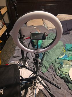 Brand Neweer ring light and stand with camera ,phone, light attachments and extra stand and foam protectors if wanted.