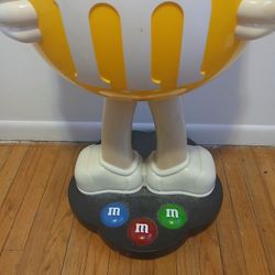 Giant Yellow M&M Display On Wheels