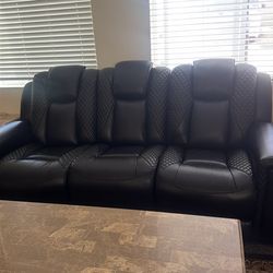 Black reclining sofa, loveseat, and chair