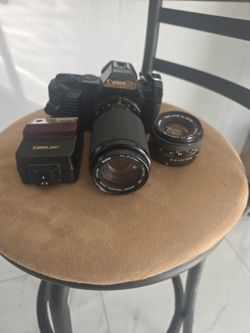 Canon T70 35mm with  Canon 244T Speedlite flash.and with second canon lense