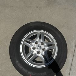 One 15” Aluminum Rim & Tire