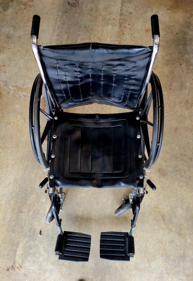 Wheelchair With Arm And Foot Rests