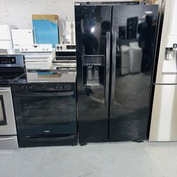 Whirlpool refrigerator, stove, dishwasher, and microwave, all black, with a receipt for a 60-day warranty.
