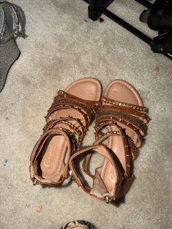 Brown and gold sandals
