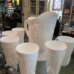 Beautiful MILK GLASS AND 6 TUMBLERS. GORGEOUS CONDITION. 7 piece set for 125.00.  Johanna at Antiques and More. Located at 316b Main Street Buda. Anti