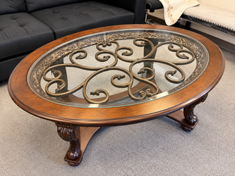 Oval Glass Top Coffee Table – Wood & Metal Scroll Design