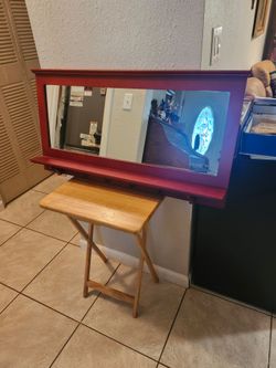 Mirror with coat hooks
