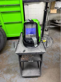 Welding cart and used welding helmet