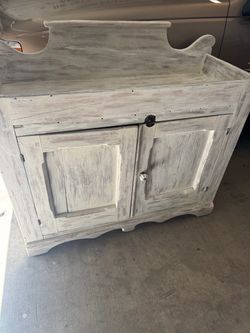 Rustic Whitewashed Wood Cabinet with Backsplash