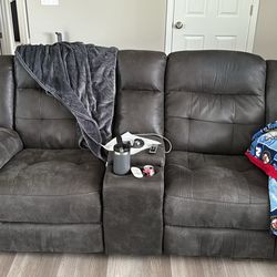 Mesa gray reclining sofa and loveseat with console and cup holders
