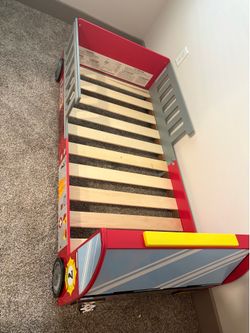 Fire truck toddler bed frame and crib size mattress