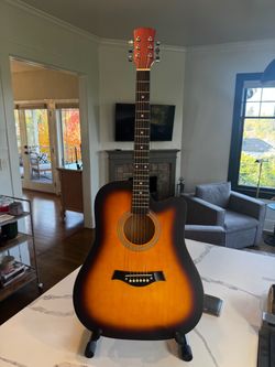 Beautiful sunburst acoustic guitar with protective bag