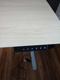 Adjustable standing desk with dual monitor arm