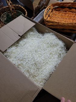 Assortment of baskets with shredded filler and green moss