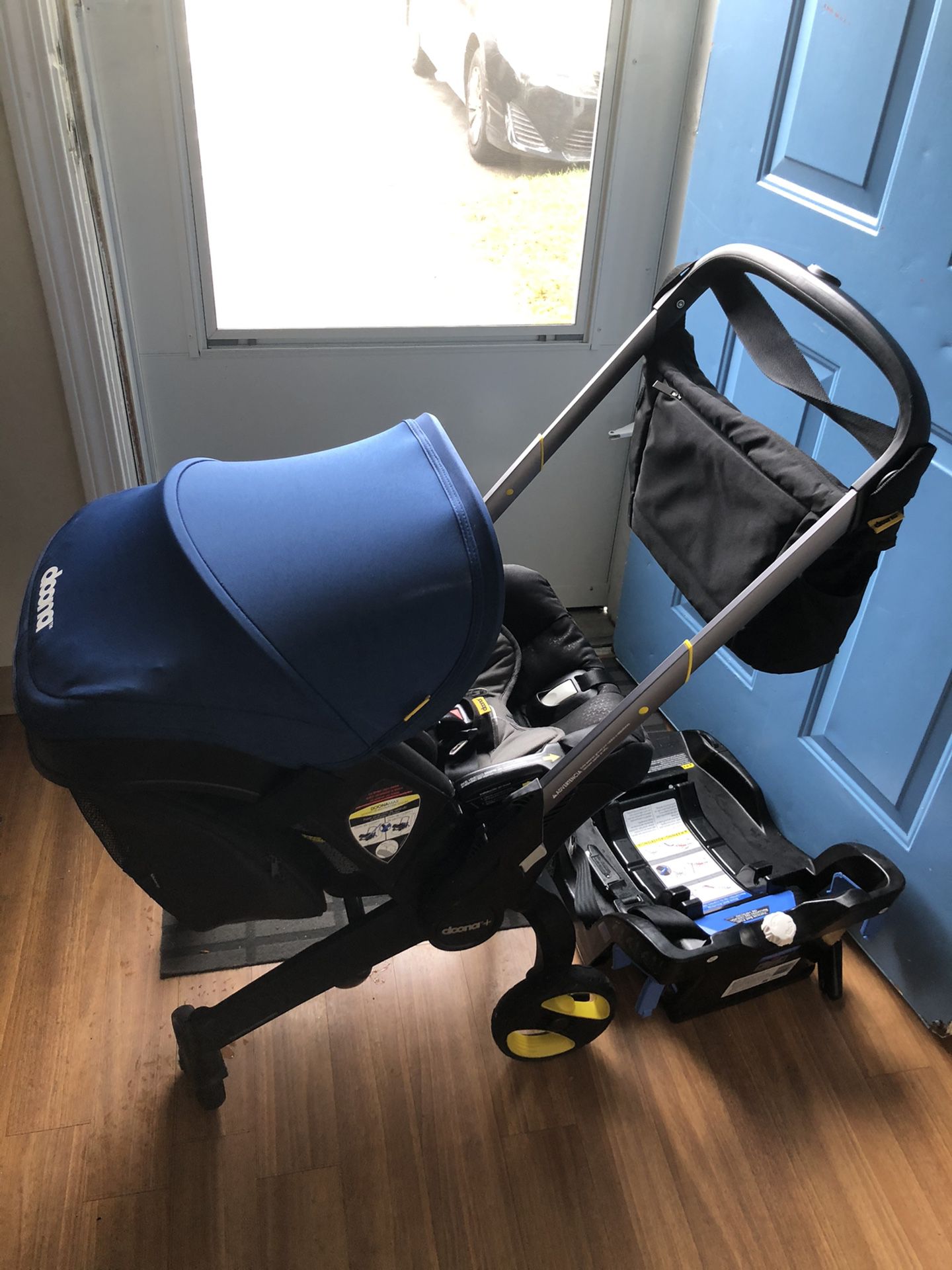 Doona carseat stroller with all the accessories, walker and musical crib