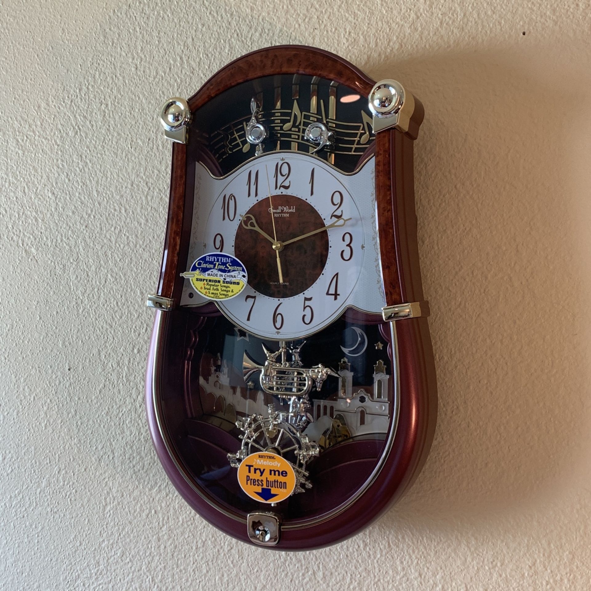 Rhythm Musical Clock