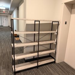 industrial-style, five-tier bookshelf with a light wood-grain finish and black metal frame.