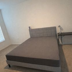 Queen bed with backrest and base, 40-inch television not smart