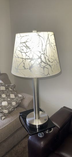 lamp with round base with two additional plug in outlets