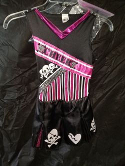 Cheerleader costume with pom poms
