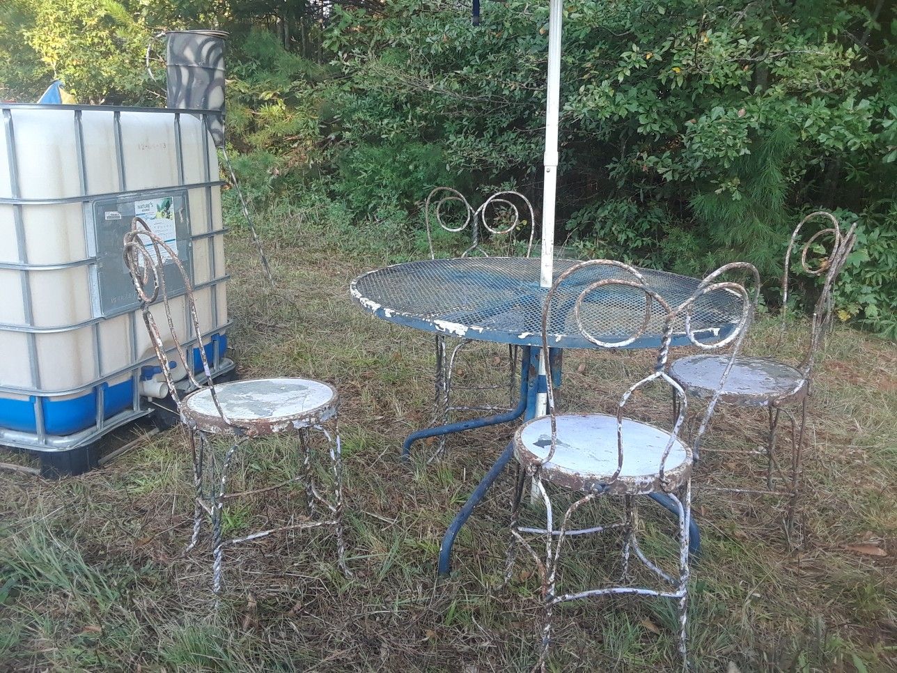 Antique ice cream parlor chairs with table