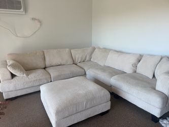 L-shaped sectional sofa with a matching oversized ottoman