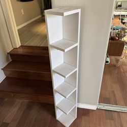 Narrow white corner shelf