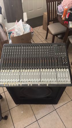 Mackie Onyx 24.4 24-channel analog mixing console along with 2 additional big speakers